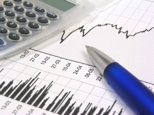 stock chart with calculator and pen