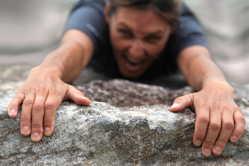 Rock climber holding on