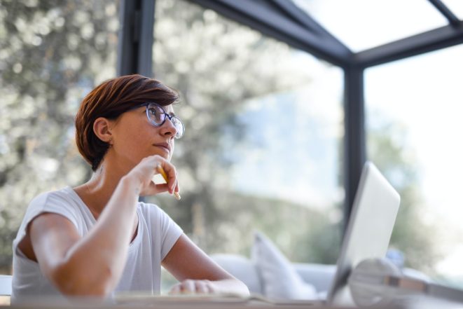 Woman considering Teachable pricing plans