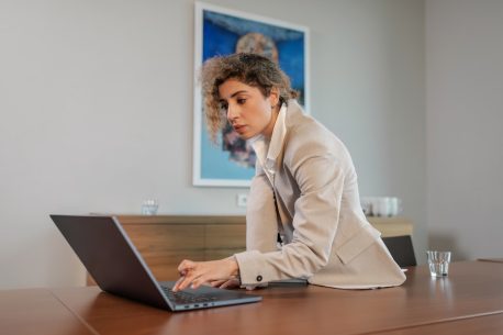 Woman at laptop trying to understand sales funnels