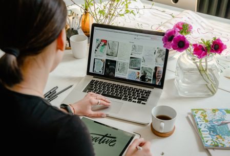 Woman at laptop designing a digital download