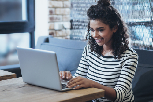 Woman at laptop creating course outline template